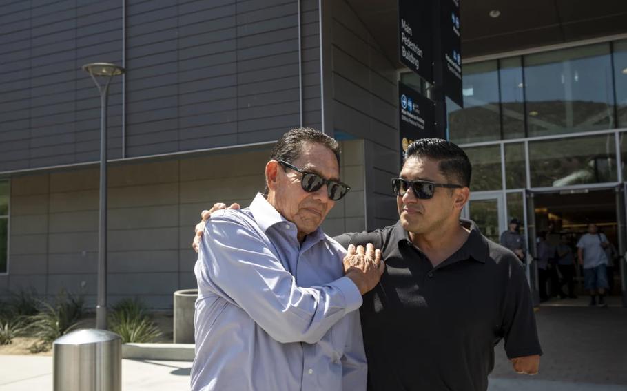 Agustin Abarca, left, is greeted by his son Juan after receiving citizenship in San Ysidro, Calif. on Thursday, Sept. 9, 2021.