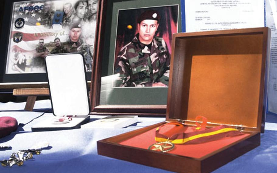 Staff Sgt. Juan Ridout, one of two Kadena special operations pararescuemen who died in a helicopter crash in the Philippines, received a meritorious service medal posthumously at a memorial service in February on Okinawa.