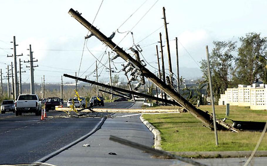 Utility poles on Guam are left toppled in the wake of Typhoon Pongsona.