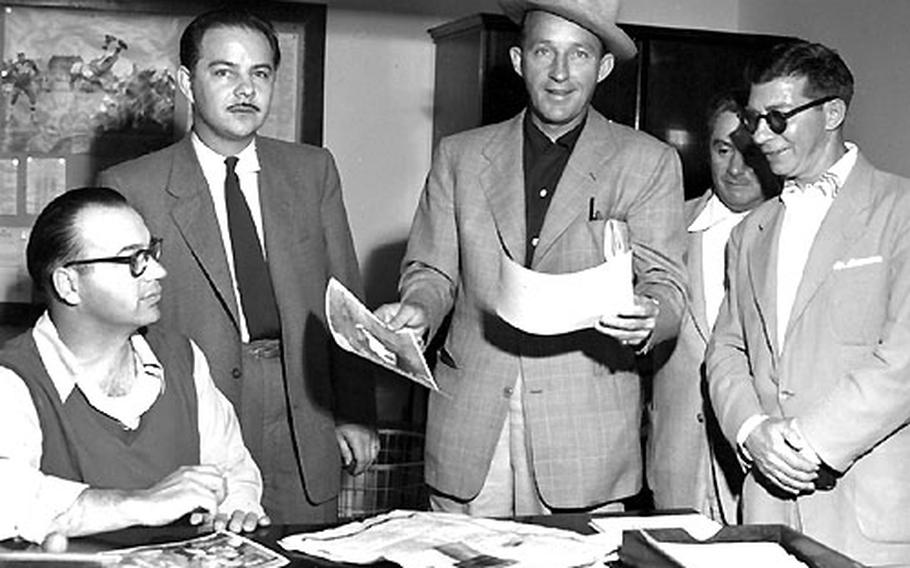 Bing Crosby visits the Stars and Stripes newsroom in Darmstadt, Germany, in 1953. Left to right: Sports editor Jack Ellis, editor Ken Zumwalt, Crosby, and staffers John Livingood and Ernie Reed.