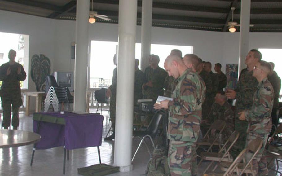 About 35 Marines from 3rd Battalion, 8th Marines out of Camp Lejeune, N.C., gathered Sunday morning for Palm Sunday services held in a pavilion at “Camp Stingray” in Port au Prince, Haiti.