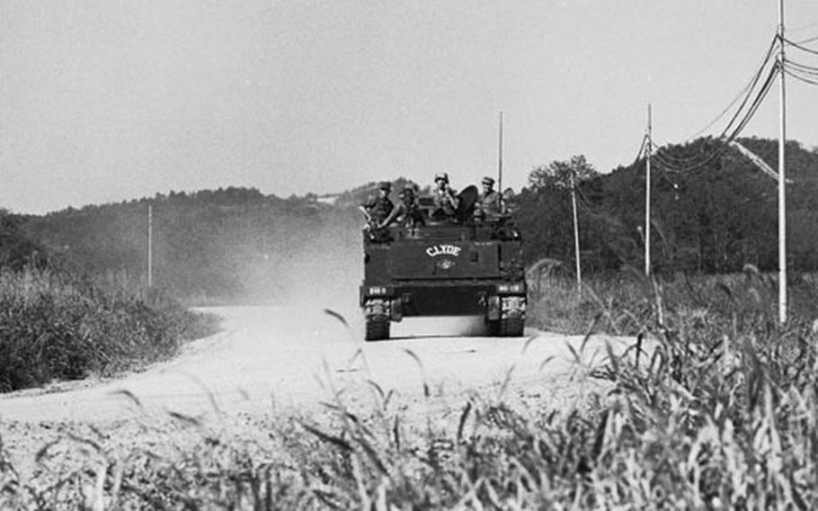 An armored personnel carrier from 1st Battalion, 9th Infantry, arrives to assist in the search for possible North Korean infiltrators near the DMZ in September 1968.