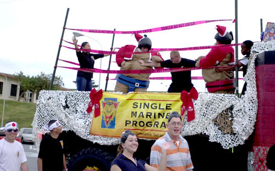 Troops from the Single Marines Program showed a unique twist to their holiday spirit with two sumo-wrestling Santas.