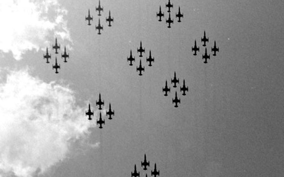 A formation of CF104s flies over the ceremony at Soellingen AB.