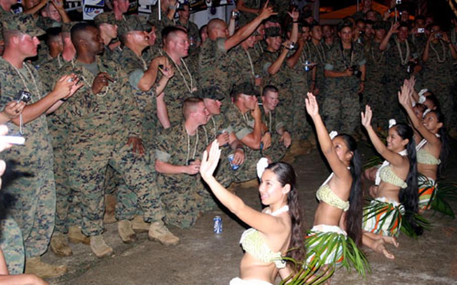 Dancers with the Natibu Dance Academy Chamorro dance troupe entertain Marines with the 31st MEU during an evening barbecue at the residence of John Gerber, a Marine Corps veteran.