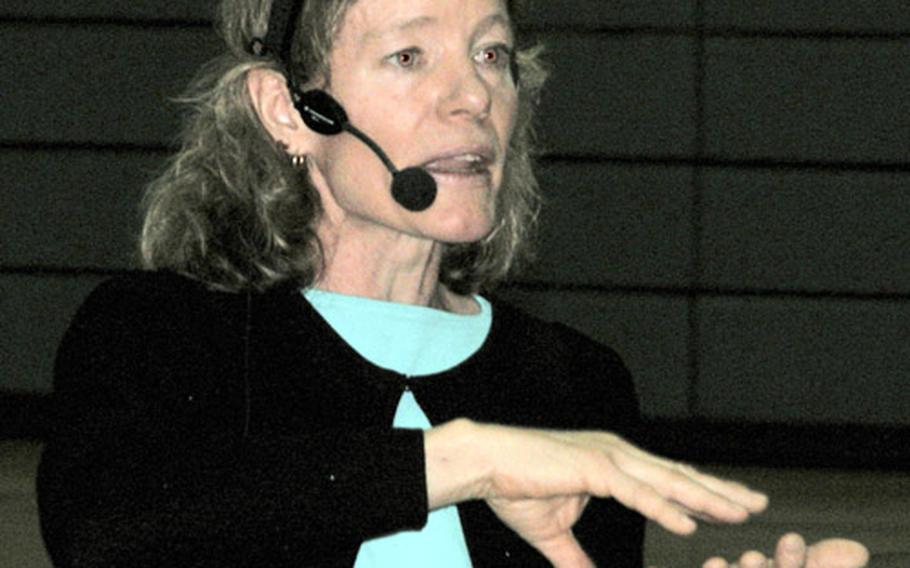 Stacy Allison, the first American woman to reach the top of Mount Everest, gives a motivational speech to the troops in Bamberg, Germany, on Wednesday.