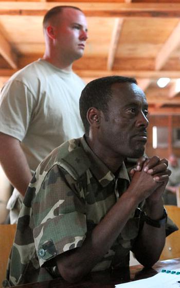 U.S. Army 1st Lt. Ben Daughters, 24, of Chillicothe, Ohio, stands behind an Ethiopian army lieutenant and trainee during a recent class on conducting ambushes.