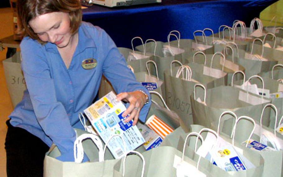 Staci Rosen, Marine Corps Community Services wellness director, checks bags filled with material given to each volunteer in the study.