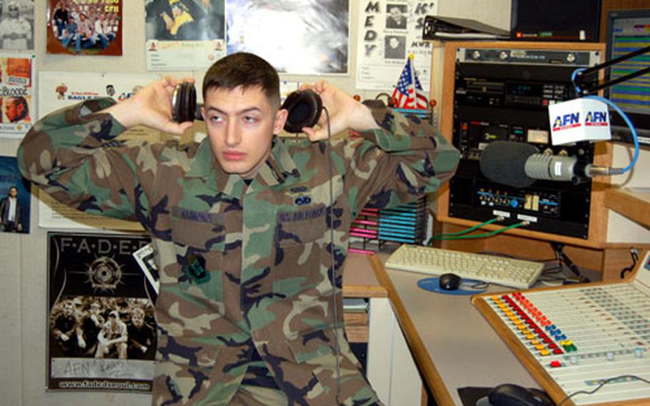 American Forces Network – Korea Disc Jockey, Air Force Staff Sgt. Ken Raimondi gets ready to conduct his daily radio show at AFN-K headquarters at Yongsan Garrison.