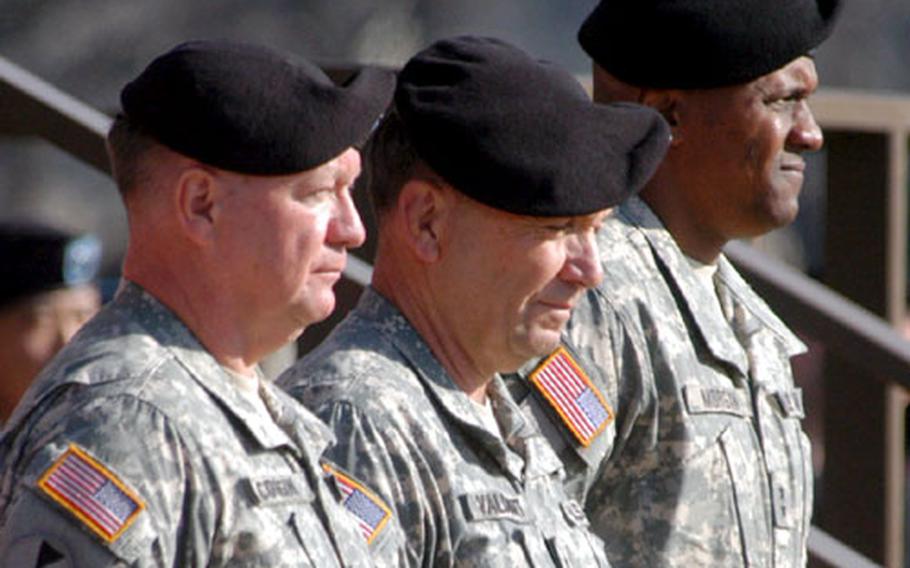 Outgoing 2nd Infantry Division commander Maj. Gen. James Coggin, left, 8th U.S. Army Commander Lt. Gen. David Valcourt, center, and incoming 2nd ID commander Maj. Gen. John Morgan III stand at the front of the formation during the 2nd ID change of command ceremony Wednesday at Camp Casey.