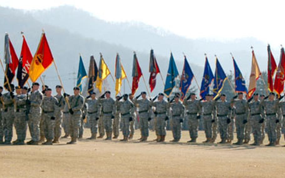 Units from the 2nd Infantry Division display their colors during the 2nd ID change of command ceremony Wednesday at Camp Casey.