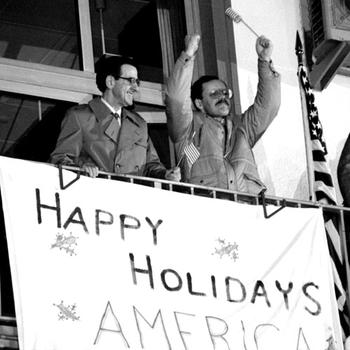 Terry Anderson and another newly-released hostage, Joseph Cicippio, on a balcony at Wiesbaden. Cicippio, a financial officer at the American University in Beirut, was held for over five years.