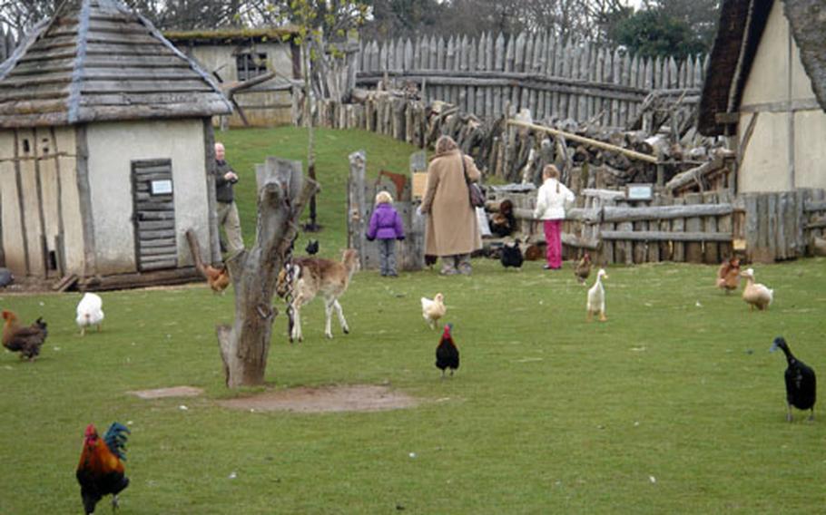 A woman and her daughter meander through the grounds of Mountfitchet Castle, a replica of the Norman village built in the early 11th century.