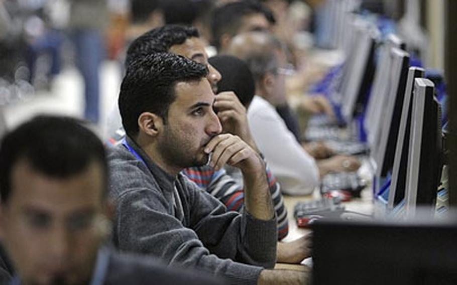 Counting and data input workers at the Independent High Electoral Commission (IHEC) prepare for Sunday&#39;s parliamentary elections, at the IHEC headquarters in Baghdad, Iraq, Saturday, March 6.