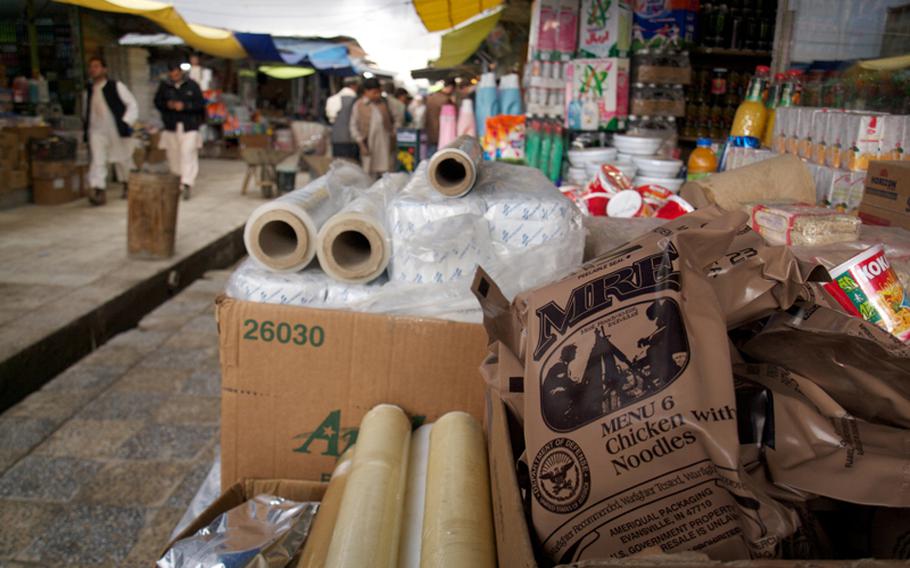 Afghans browse Kabul’s “Bush Market,” which specializes in goods apparently stolen from American supply convoys, such as field rations, laundry detergent, toilet paper and hundreds of other items.