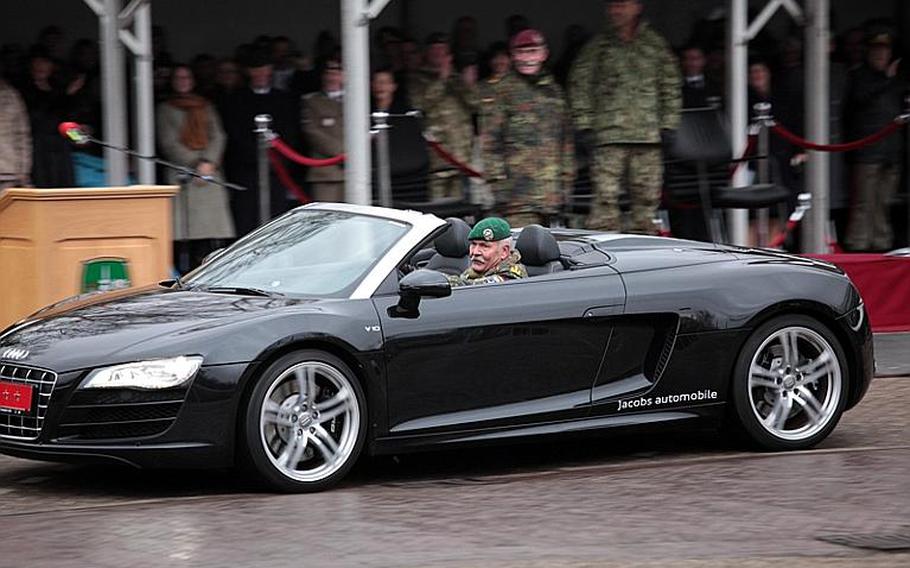 Adding a bit of humor to the end of his military career, German Gen. Wolf Langheld circled the ceremony grounds twice in an Audi R8 before driving off. Langheld relinquished command of NATO's Allied Joint Force Command Brunssum Friday to German Gen. Hans-Lothar Domröse.