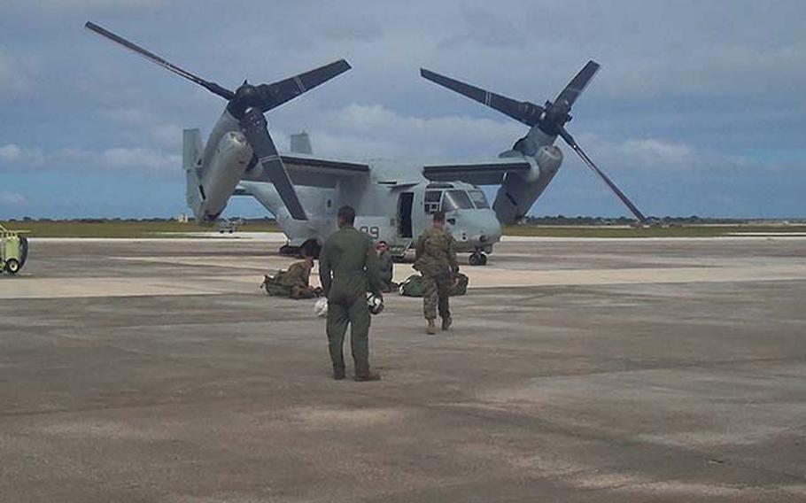 Crew members from the 1st Marine Aircraft Wing from Okinawa, Japan walk toward the MV-22 Thursday, Dec. 13, 2012 at Andersen Air Force Base on Guam. Three Ospreys from the wing arrived on Guam this week to participate in exercise Forager Fury, the first for the Japan-based aircraft since arriving on Okinawa this fall.