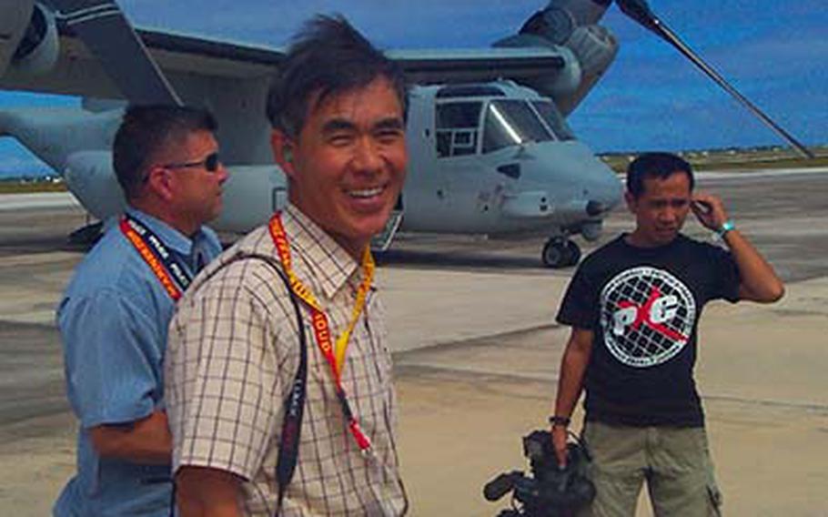 Toshio Matsumura, the deputy consul general for Japan on the island of Guam, prepares to ride in the MV-22 Osprey Thursday, Dec. 13, 2012, at Andersen Air Force Base. Matsumura was among a group of dignitaries, politicians and reporters invited by the Marines for a familiarization flight on the helicopter-airplane hybrid while they participated in exercise Forager Fury on Guam and Tinian.