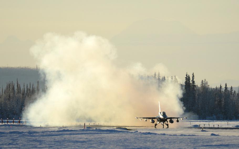 An F-16 Fighting Falcon from the 18th Aggressor Squadron takes off from Eielson Air Force Base, Alaska, on Feb. 10, 2014. Ten Aggressors took off in succession to fly to Anderson Air Force Base, Guam, to support Cope North, a field-training exercise hosted by Pacific Air Forces.