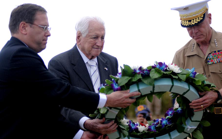 From left, Kurt Tong, deputy chief of mission for the U.S. Embassy in Japan; Lawrence Snowden, founder of the Reunion of Honor tour; and Gen. James Amos, commandant of the Marine Corps, lay a wreath during the 19th Annual Reunion of Honor on Iwo Jima, Japan, March 19, 2014.