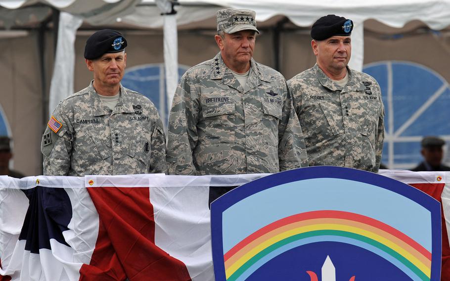 From left, outgoing U.S. Army Europe commander Lt. Gen. Donald Campbell Jr., EUCOM commander Gen. Philip Breedlove and incoming USAREUR commander Lt. Gen. Frederick ''Ben'' Hodges watch the proceedings at the change-of-command ceremony in Wiesbaden, Germany, Wednesday, Nov. 5, 2014.