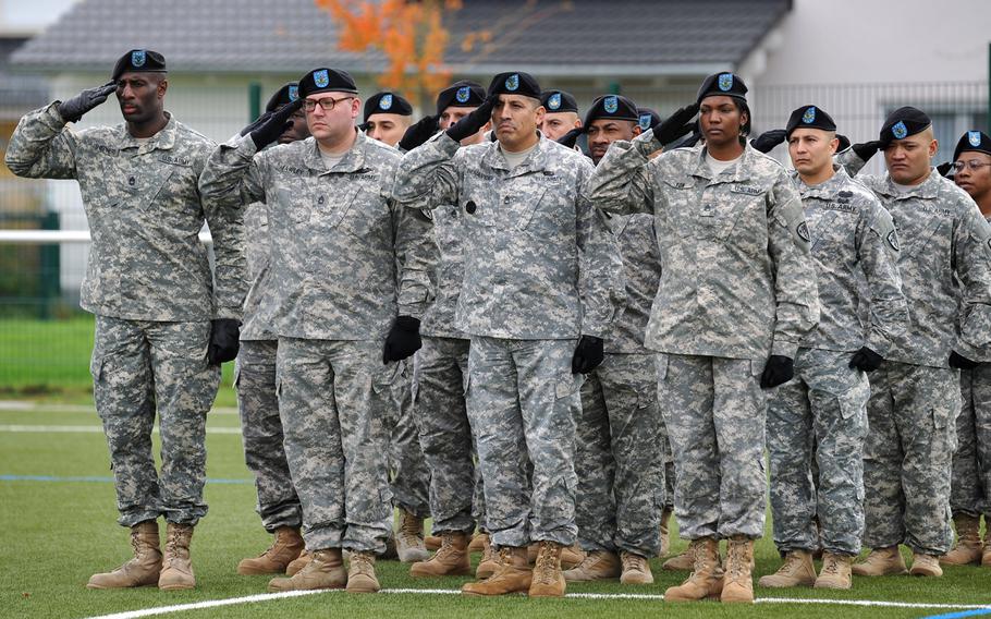 U.S. Army Europe soldiers salute during the playing of the national anthem at the USAREUR change-of-command ceremony in Wiesbaden, Germany, Wednesday, Nov. 5, 2014. Lt. Gen. Frederick ''Ben'' Hodges took the reins from Lt. Gen. Donald Campbell Jr. at the ceremony.