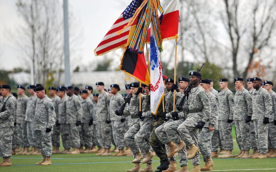 The honor guard marches in for the posting of the colors at the U.S. Army Europe change-of-command ceremony in Wiesbaden, Germany, Wednesday, Nov. 5, 2014.