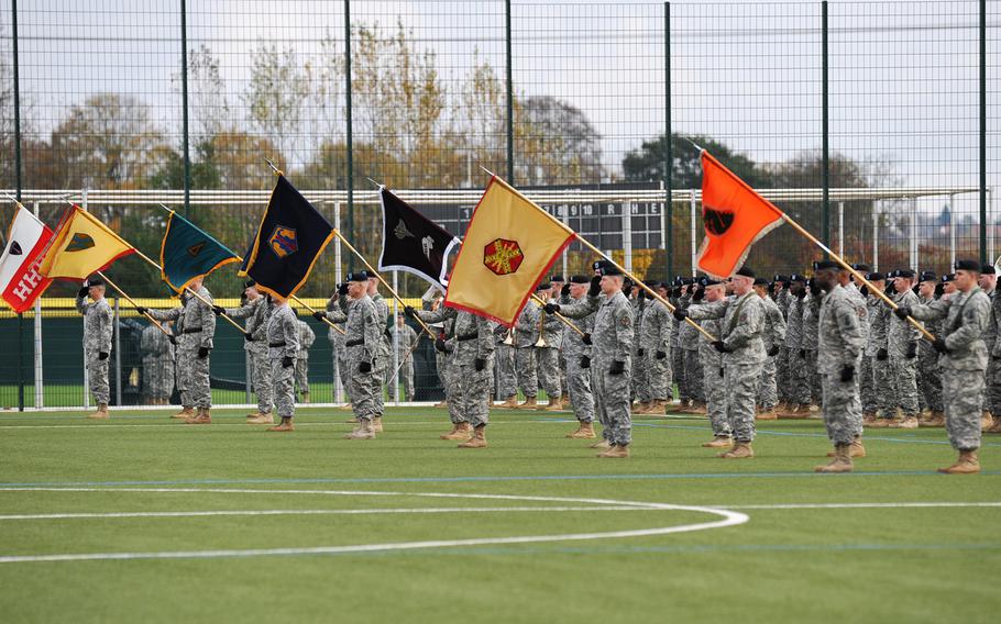 Soldiers representing U.S. Army Europe units stand during the rendering of honors at the USAREUR change-of-command ceremony in Wiesbaden, Germany, Wednesday, Nov. 5, 2014.