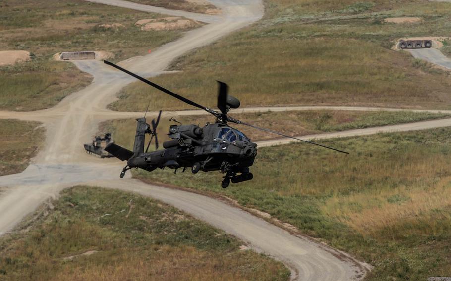 An AH-64 Apache helicopter from the 2nd Battalion, 2nd Aviation Regiment, 2nd Combat Aviation Brigade provides attack support to ground forces Sept. 21, 2015, during training at the Rodriguez Live Fire Complex in South Korea. The Army has identified two pilots killed when an Apache crashed Nov. 23, 2015, about 50 miles east of Camp Humphreys.