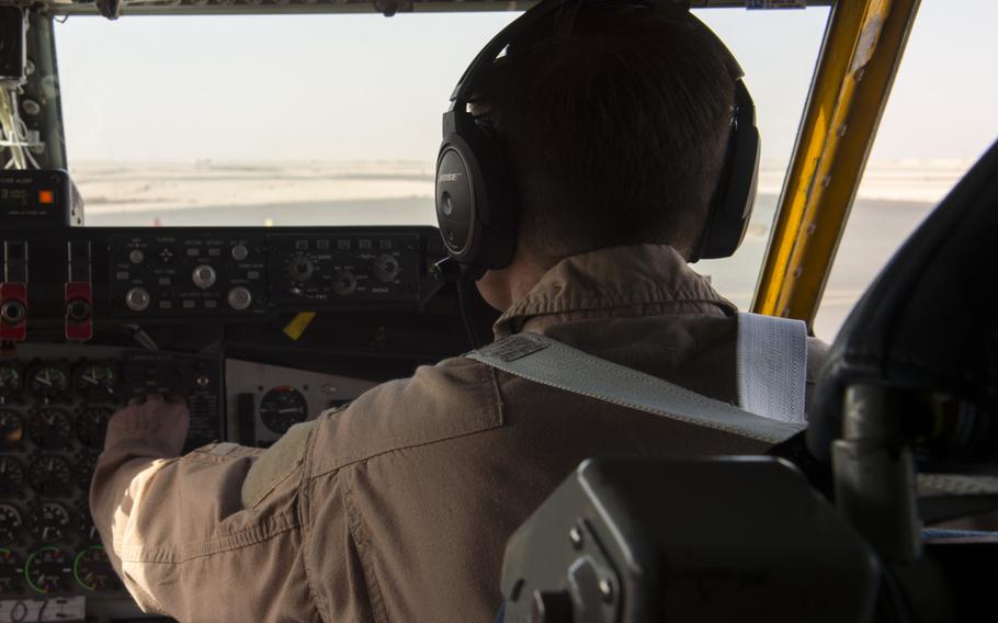 KC-135 Stratotanker co-pilot 1st Lt. Scott checks equipment prior to taking off from Al Udeid Air Base in Qatar for a refueling mission in support of the air campaign against the Islamic State group in Iraq and Syria on March 24, 2016. Crewmembers could not be identified by their full names for security reasons.