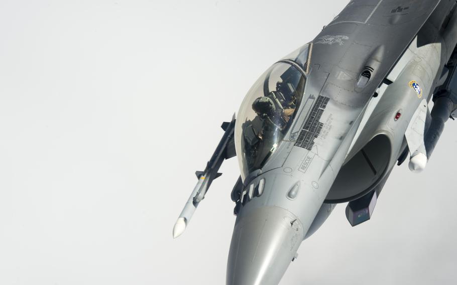 An F-16 fighter supporting the air campaign against the Islamic State group in Iraq and Syria maneuvers away from a KC-135 Stratotanker after an aerial refueling on March 24, 2016.