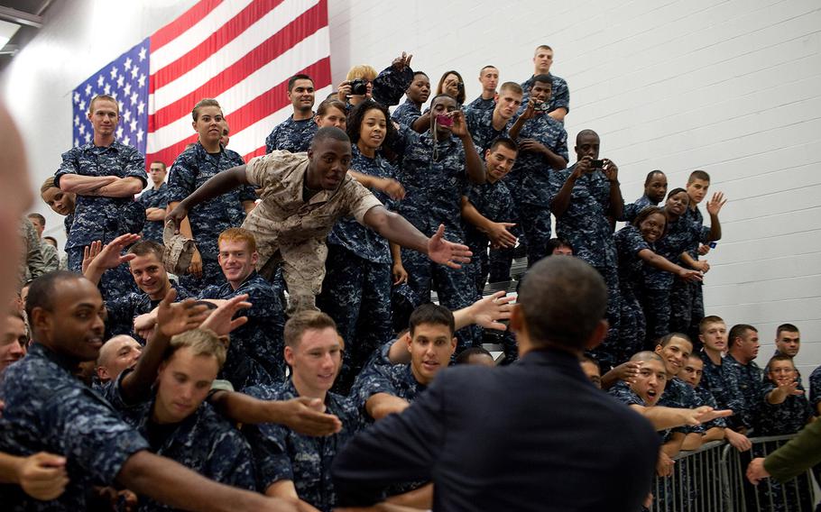 President Barack Obama greets members of the audience following his remarks at an event with military personnel at the Pensacola Naval Air Station in Pensacola, Fla., June 15, 2010. This was the President's fourth trip to the Gulf Coast to assess the ongoing response to the BP oil spill in the Gulf of Mexico.