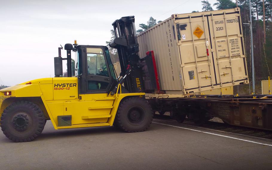 A heavy equipment operator with the Theater Logistics Support Center-Europe's ammunition center uses a forklift to offload cargo containers of ammunition from a train at Miesau Depot, in Germany in 2016.