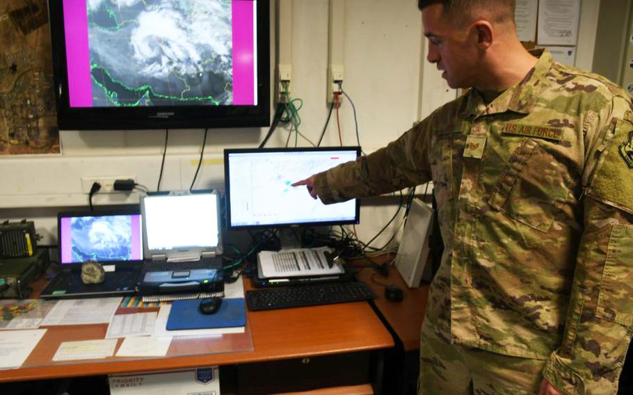 Air Force Tech. Sgt. Michael Theos of the 451st Expeditionary Operations Support Squadron's meteorological team analyzes the weather in his office at Kandahar Air Filed, Afghanistan, on March 19, 2018.