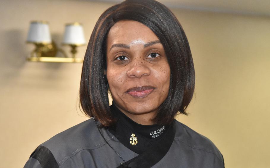 Chief Petty Officer Naomi Goodwyn oversees food preparation for officers' meals on the USS Harry S. Truman. Goodwyn, a Navy cook for 20 years, says the toughest part of her job is training inexperienced cooks during the demanding pace of deployment.