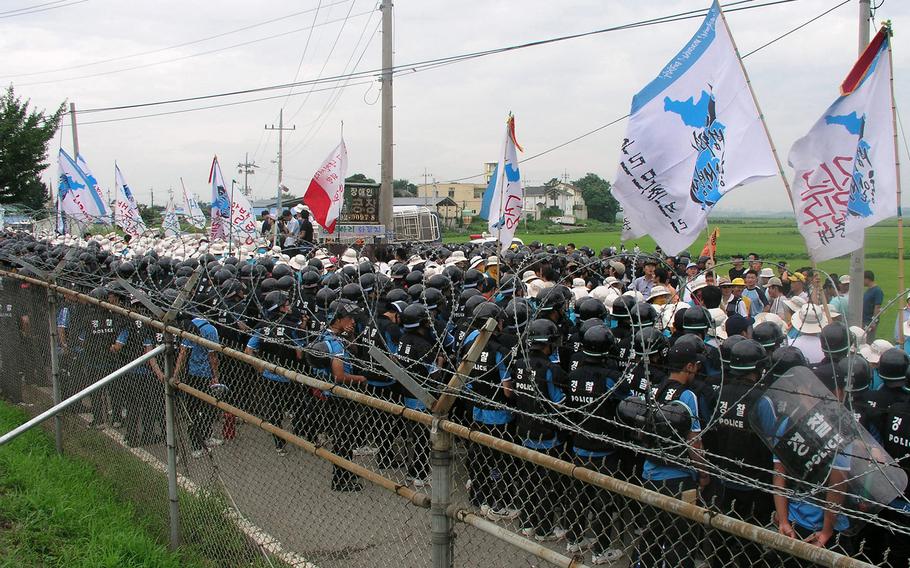 South Korean college students protest on Aug. 8, 2005, against plans that will see Camp Humphreys triple in size.