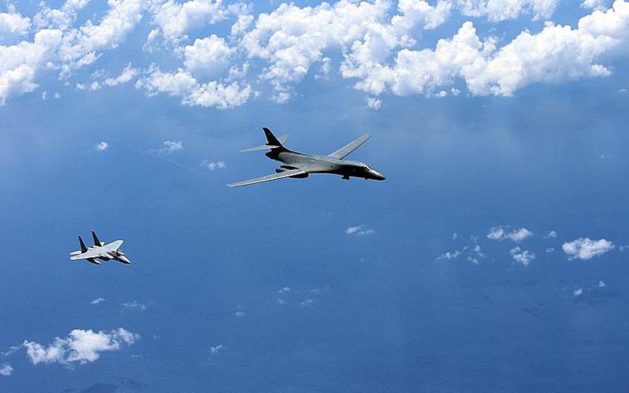 An Air Force B-1B Lancer flies with a Japanese F-15 above the East China Sea near the Senkaku Islands, Aug. 15, 2017.