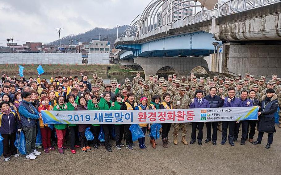 U.S. soldiers from Camp Casey and volunteers at the Shincheon River clean up in Dongducheon, South Korea, Thursday, March 21, 2019.