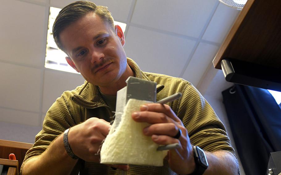 Staff Sgt. William Riddle, a 48th Civil Engineer Squadron Explosive Ordnance Disposal NCO, designs a model for a training aid at RAF Lakenheath, England, Nov. 19, 2019.