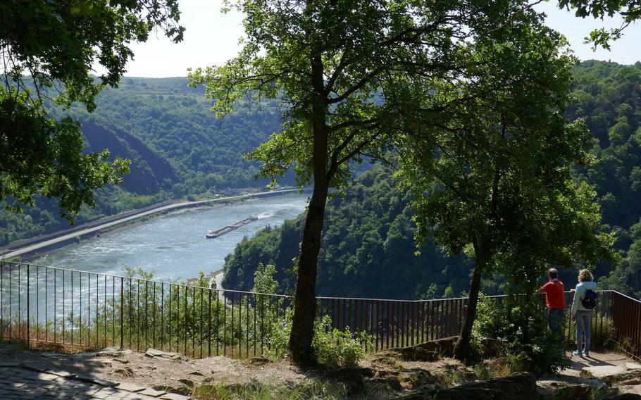 A couple watches a boat travel down the Rhine River from one of the viewing areas on top of the Lorelei, the storied outcrop that towers 410 feet above the river.