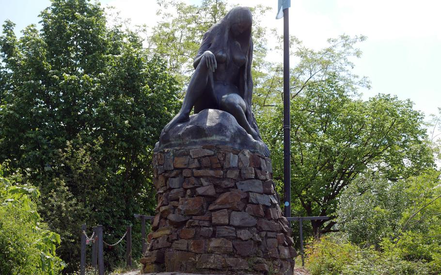 The statue of Lorelei, the siren that, according to lore, lured sailors to crash their boats on the rocks at the narrowest point of the Rhine River. The statue, which stands at the end of a harbor breakwater, is by Russian artist Natascha Jusopov.