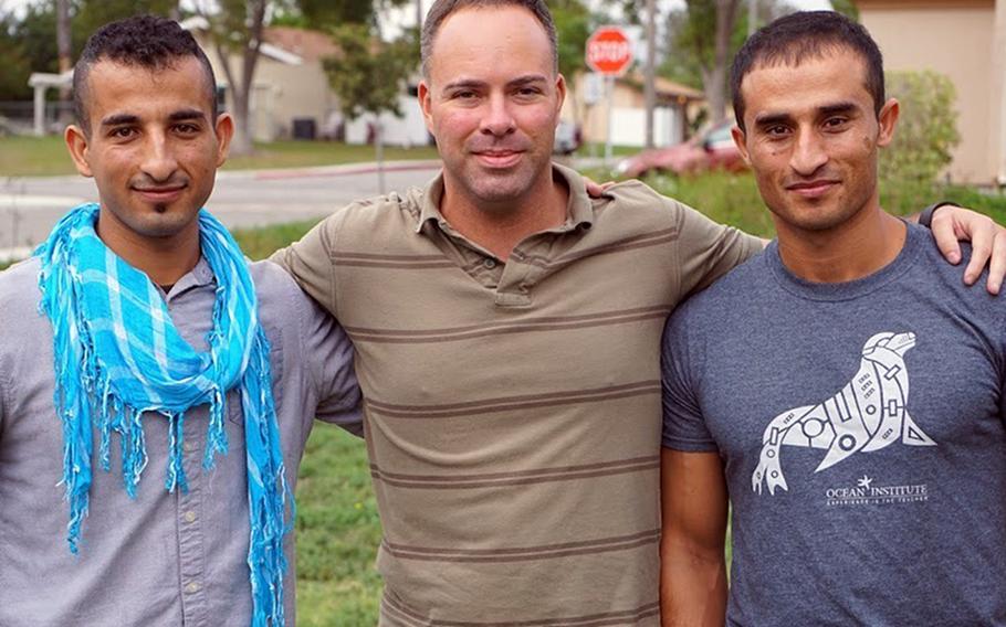 Mohammad Nadir, from left, Marine Corps Maj. Mark Nicholson and Fnu Farid reunite in 2017 in California after serving together in Sangin District, Helmand province, Afghanistan.