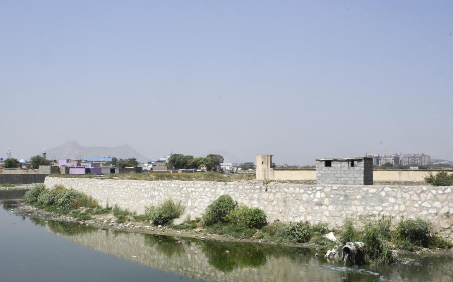 A surveillance balloon flies over a pipe where untreated sewage pours into the Kabul River near the Makroyan Waste Water Treatment Plant in Kabul, Afghanistan, Aug. 16, 2020.