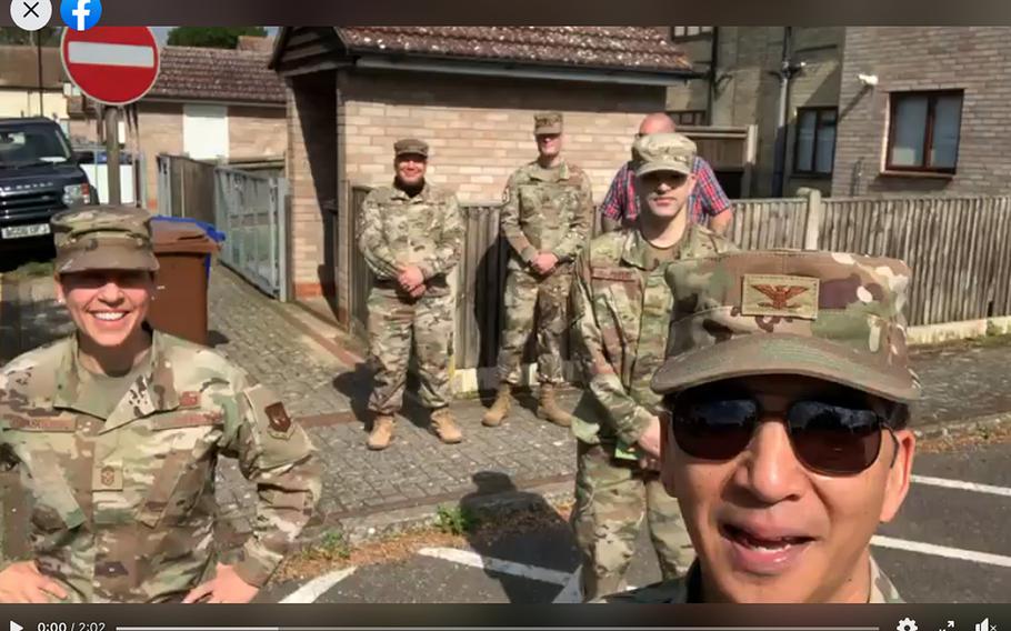 Col. S. Troy Pananon and Chief Master Sgt. Kathi W. Glascock, 100th Air Refueling Wing commander and command chief at RAF Mildenhall, England, stand in front of members of the 100th Communication Squadron in a screenshot from a daily update, Sept. 1, 2020. The command team has been giving daily video updates since March.