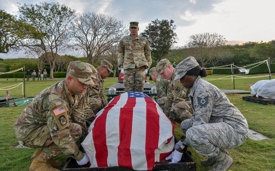 Service members assigned to the Defense POW/MIA Accounting Agency participate in a disinterment ceremony for a set of unknown remains at the National Memorial Cemetery of the Pacific, called the Punchbowl, in Honolulu, Hawaii, March 4, 2019.