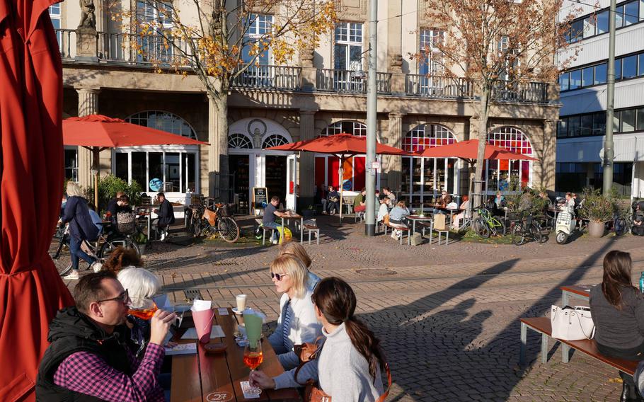 Guests enjoy wine, cocktails and coffee at Vinocentral in Darmstadt, Germany, on the last day of business before the partial lockdown in November. Although you can't enjoy a wine there at the moment, you can buy it by the bottle in the store or online for enjoyment at home.