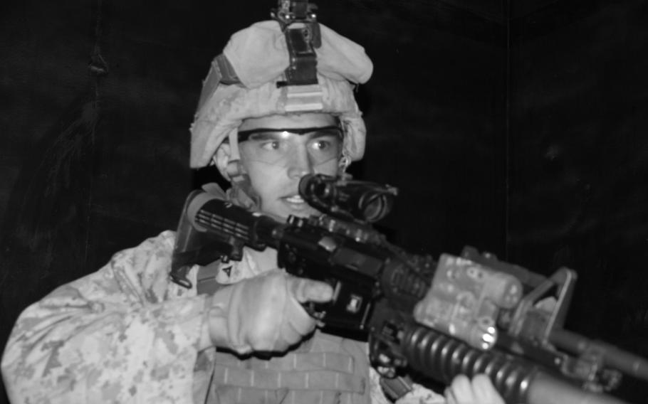 Lance Cpl. Jordan Hefner bursts into a room during a dry run through the Rodriguez Live Fire Complex's shoot-house, South Korea, in June.