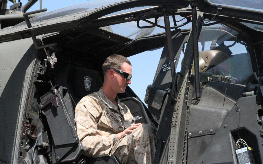 Marine Sgt. Jeremy Plympton checks out the controls in a U.S. Army Apache attack helicopter ahead of a battalion-wide exercise on June 9, 2015, in South Korea.