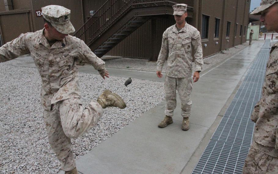 A group of Marines juggle a homemade hacky sack outside the barracks during downtime at Rodriguez Live Fire Complex near the Demilitarized Zone in June. Like actual combat, their time at Rodriguez was marked by long stretches of boredom, punctuated by short bursts of extreme action. 

