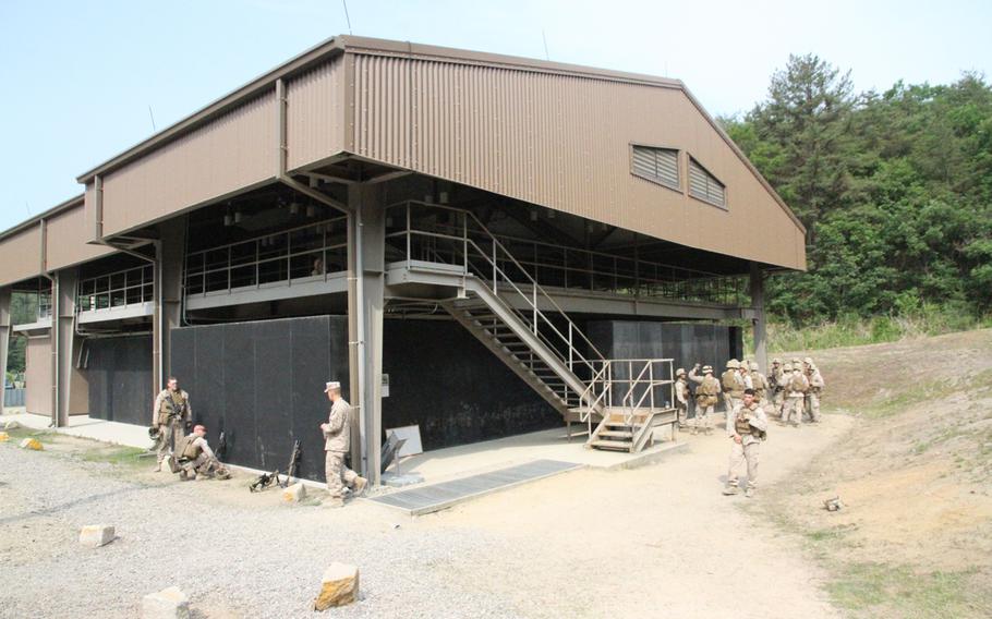 Marines from Company I line up to enter the Rodriguez Live Fire Complex's live-fire shoot-house in June 2015 in South Korea.
